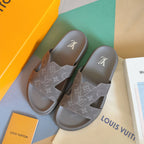 Grey Louis Vuitton slide sandals pair with embossed monogram straps and LV logo