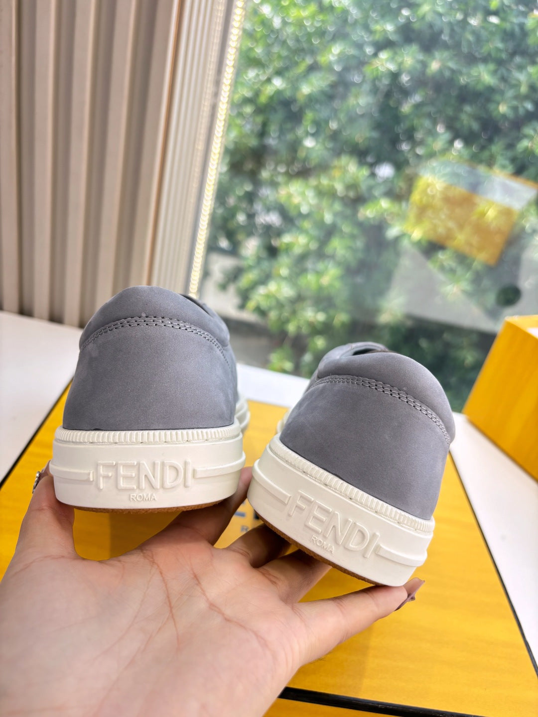 Fendi ladies sneakers heel view, gray suede-look with white heel logo trim