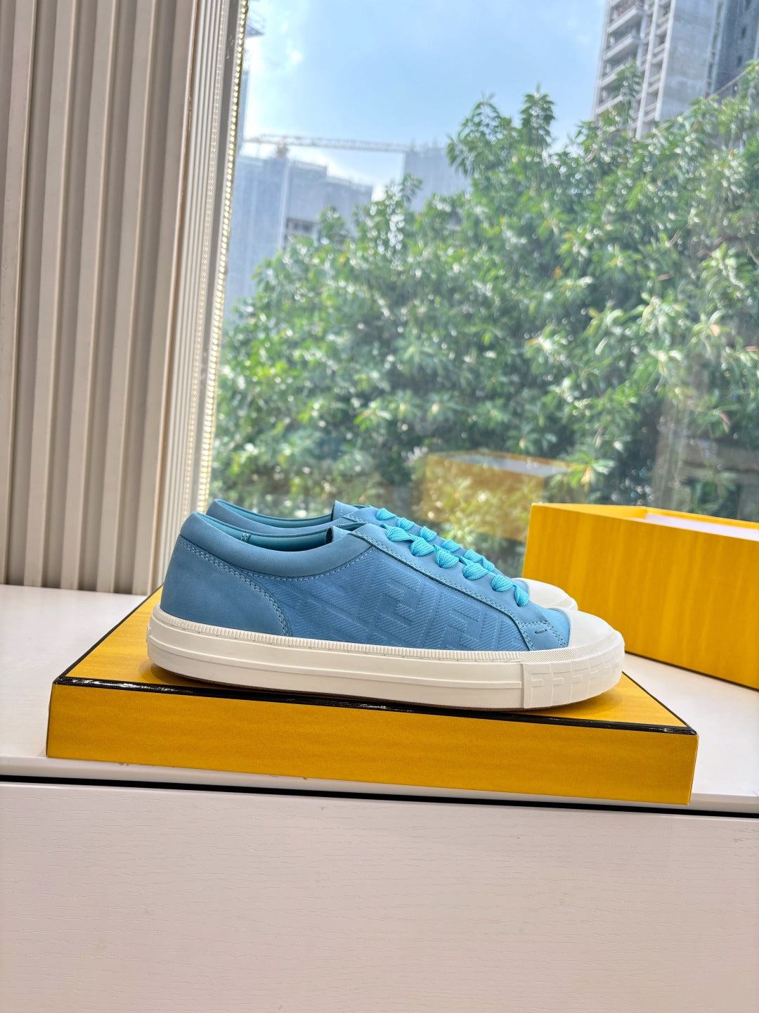Fendi ladies low-top sneaker, light blue suede upper with turquoise laces and white sole