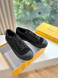 Black lace-up Fendi sneakers with textured logo panels and rubber sole