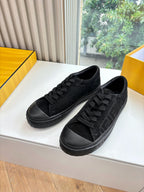 Black lace-up Fendi sneakers with embossed side detail and rubber sole