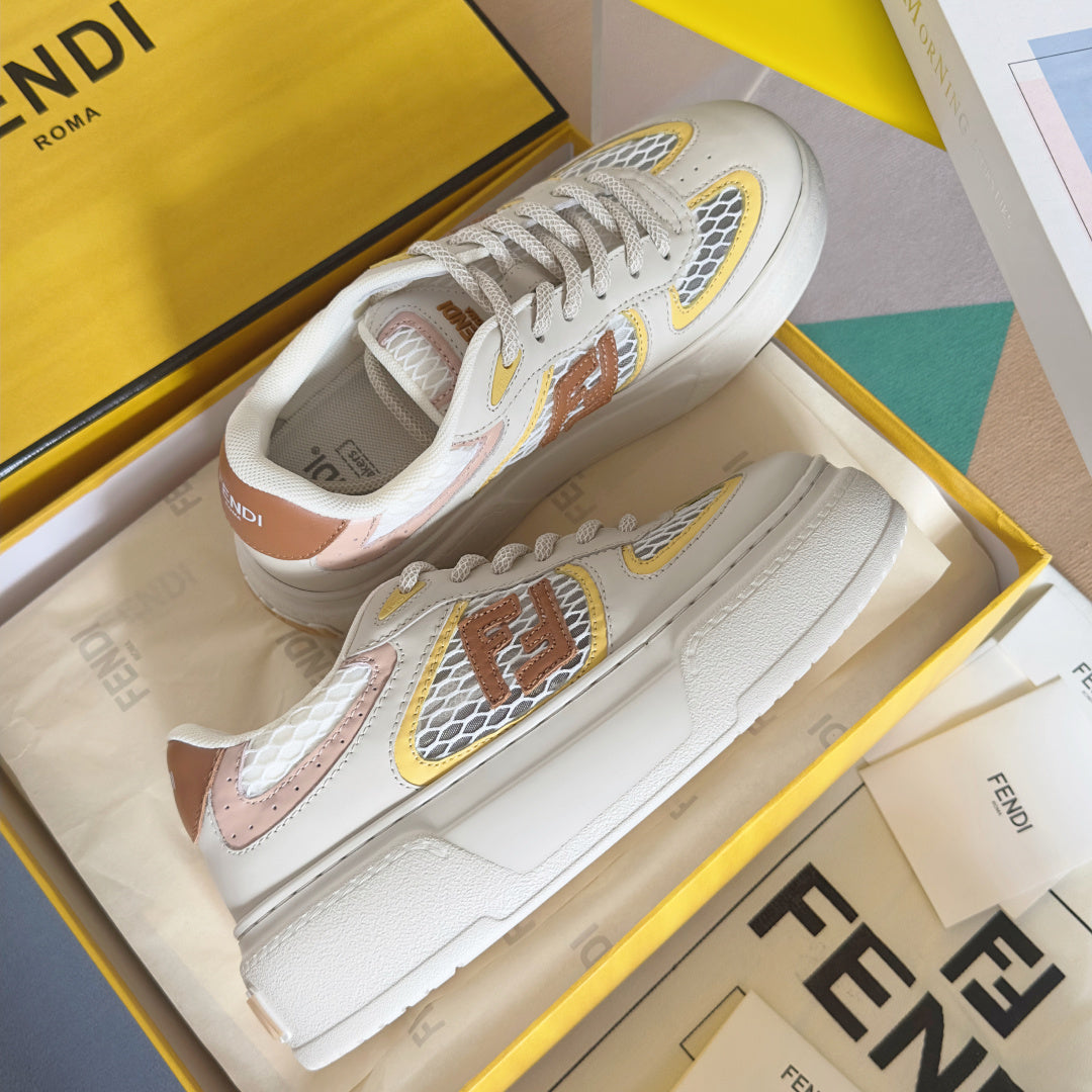 White unisex sneakers with multicolor emblem patches and textured side panels
