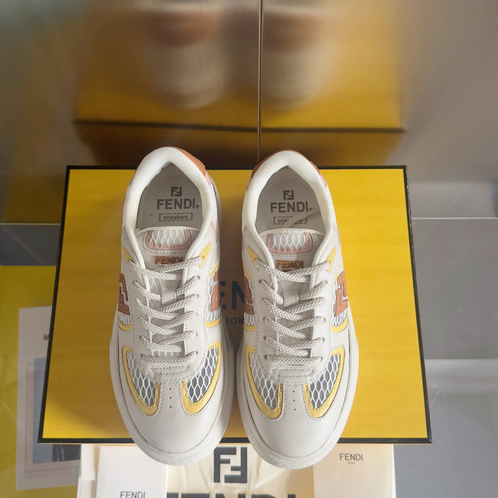 Pair of white unisex low-top sneakers with multicolor emblem patches
