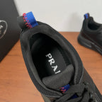 Black Prada unisex sneaker, heel label visible through collar and knit lining