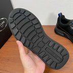 Black Prada unisex sneakers, outsole view with textured tread and thick sole