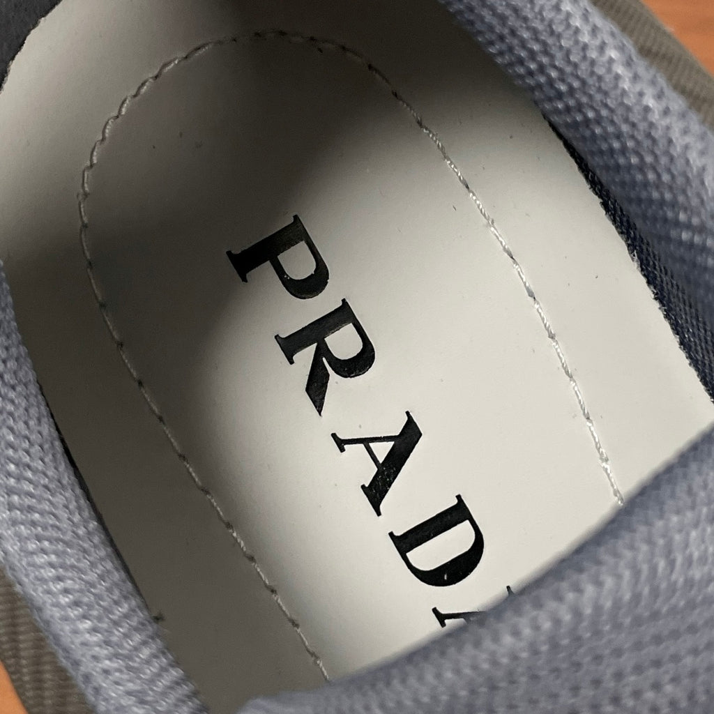 Prada unisex sneakers inner heel label with PRADA text on white lining