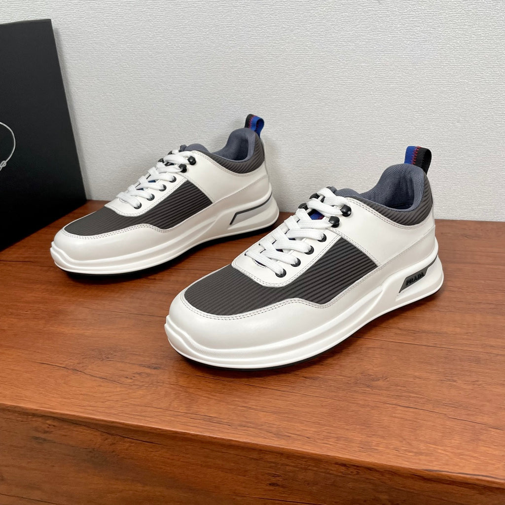 Prada unisex sneakers, white leather with dark gray panels, blue-lined tongue