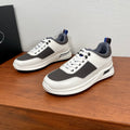 Prada unisex sneakers, white leather with dark gray panels, blue-lined tongue