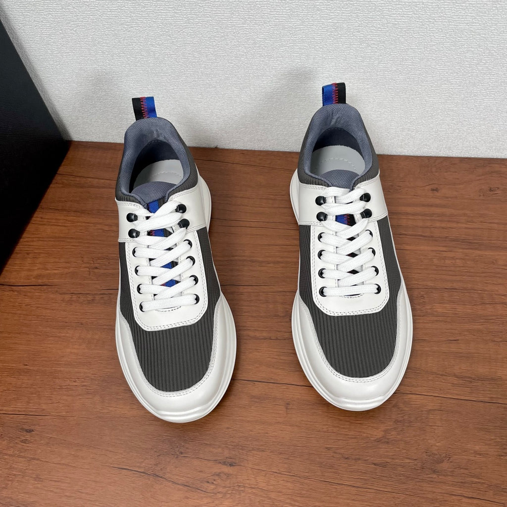 Prada unisex sneakers with white toe, dark gray quarter, blue pull-tab at heel