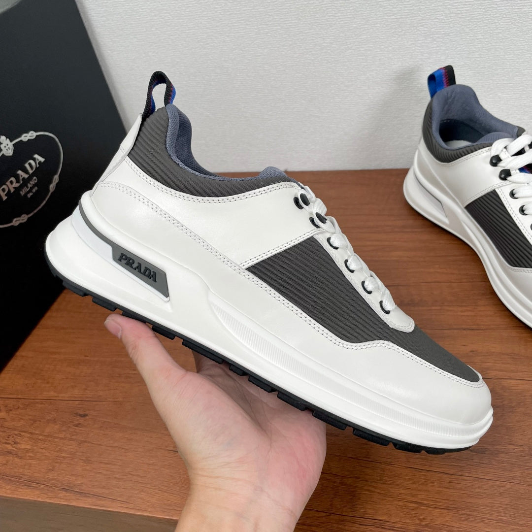 Prada unisex sneakers, white leather with dark gray side stripe and PRADA heel tab