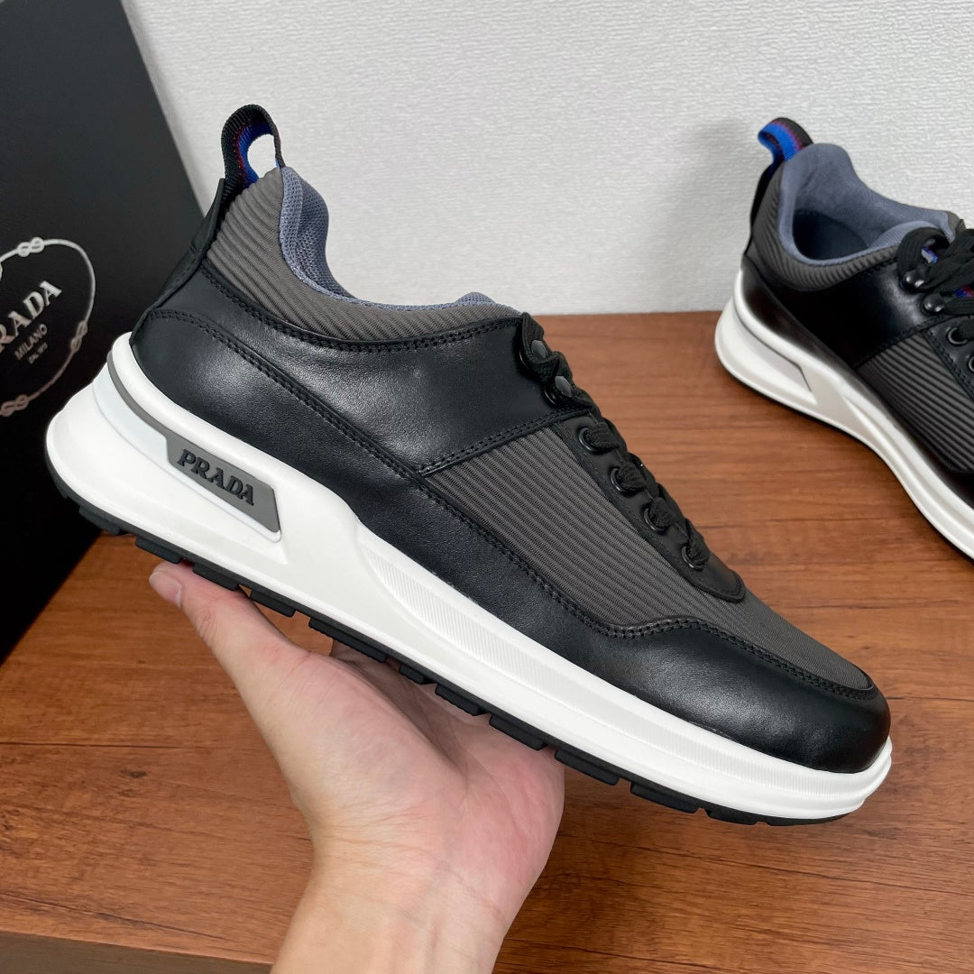 Unisex sneakers with PRADA logo, black upper and white midsole