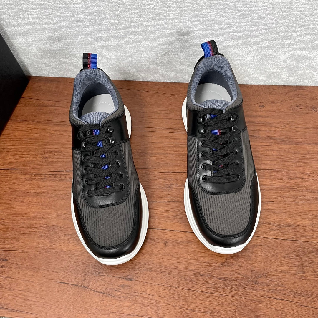 Unisex lace-up sneakers, black upper with gray textured panels and white sole