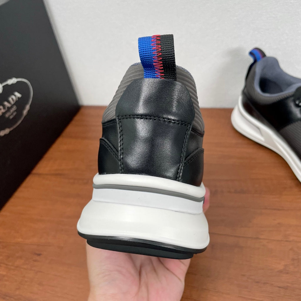 Unisex sneakers, black heel with blue and red pull tab and white midsole