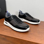 Unisex lace-up sneakers, black leather-look with gray panels and white soles