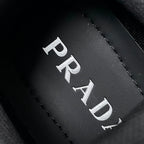 Prada logo insole detail, black leather with stitched PRADA lettering