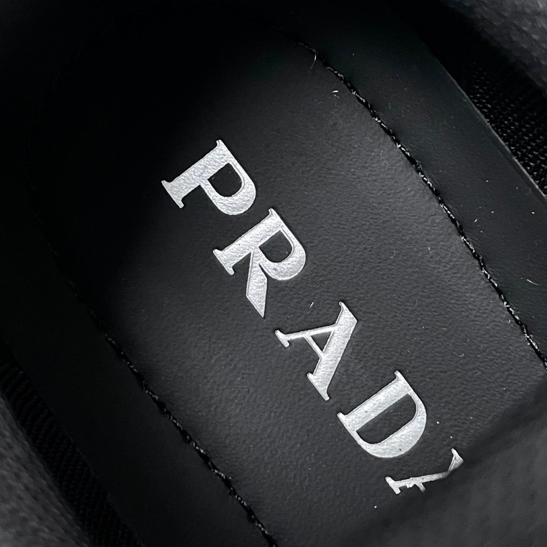 Prada logo insole detail, black leather with stitched PRADA lettering
