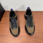 Prada unisex sneakers, front view pair in black leather with tan uppers and laces