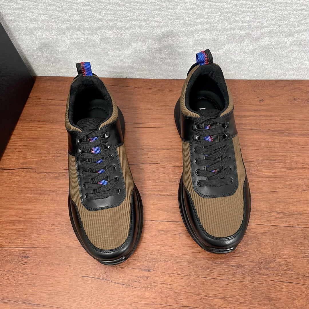 Prada unisex sneakers, front view pair in black leather with tan uppers and laces