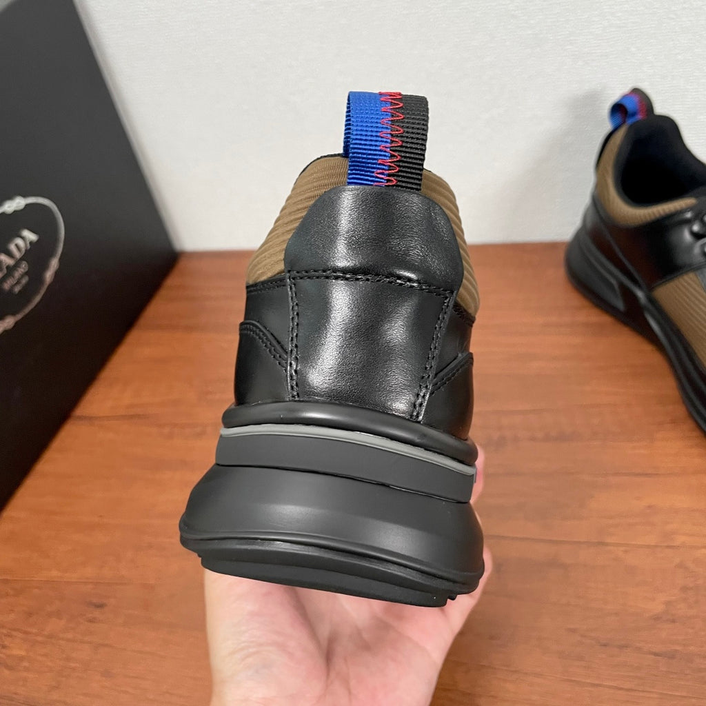 Prada unisex sneaker heel, black leather with blue-red knit heel tab