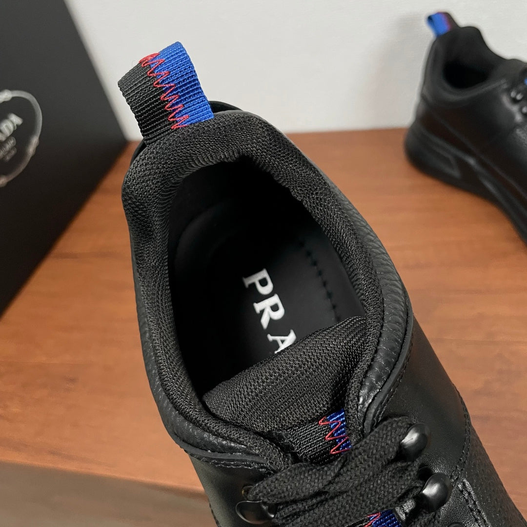Prada unisex sneaker tongue and heel area, black textile lining with PRADA lettering