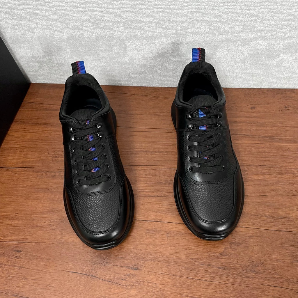 Prada unisex front view sneakers, black leather lace-ups with blue-red accent tab
