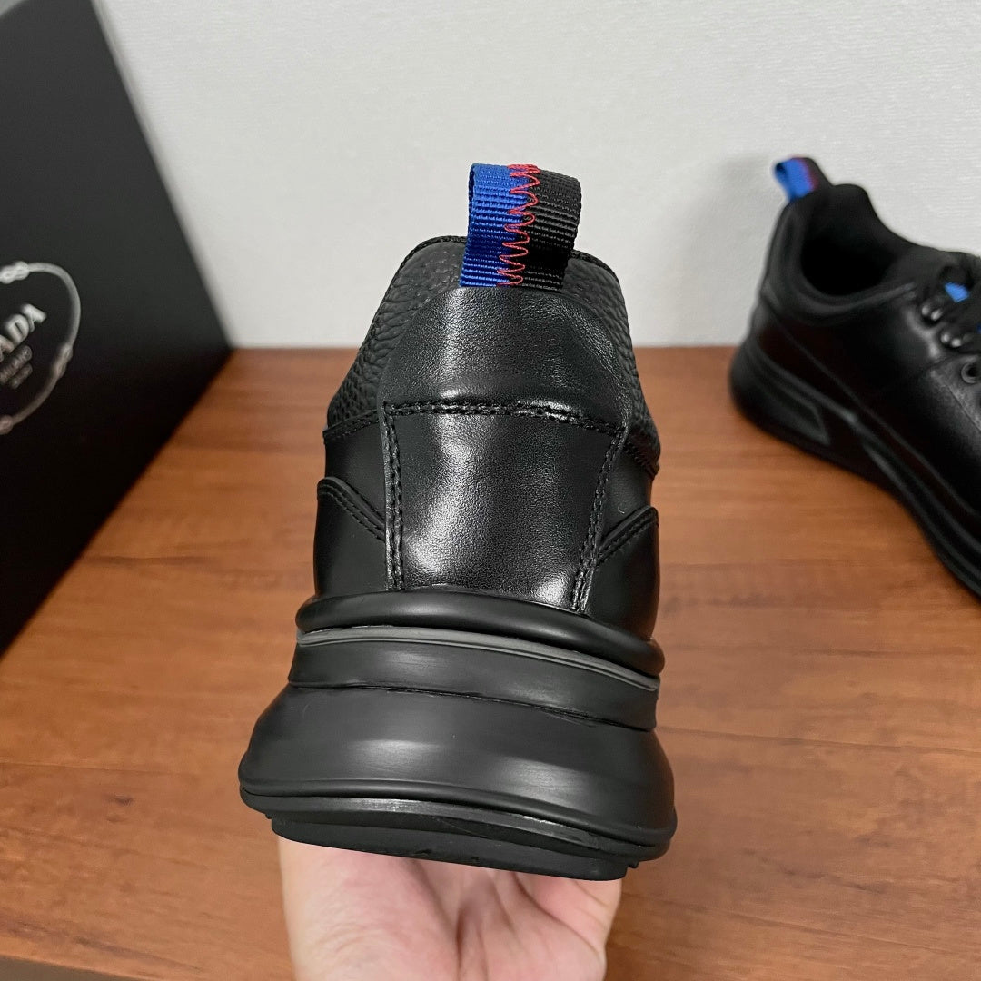 Prada unisex heel view sneaker in black leather with blue-red elastic collar