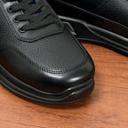 Prada unisex toe and side close-up of black leather lace-up sneaker