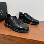Prada unisex sneakers, black leather uppers with side logo and lace-up closure