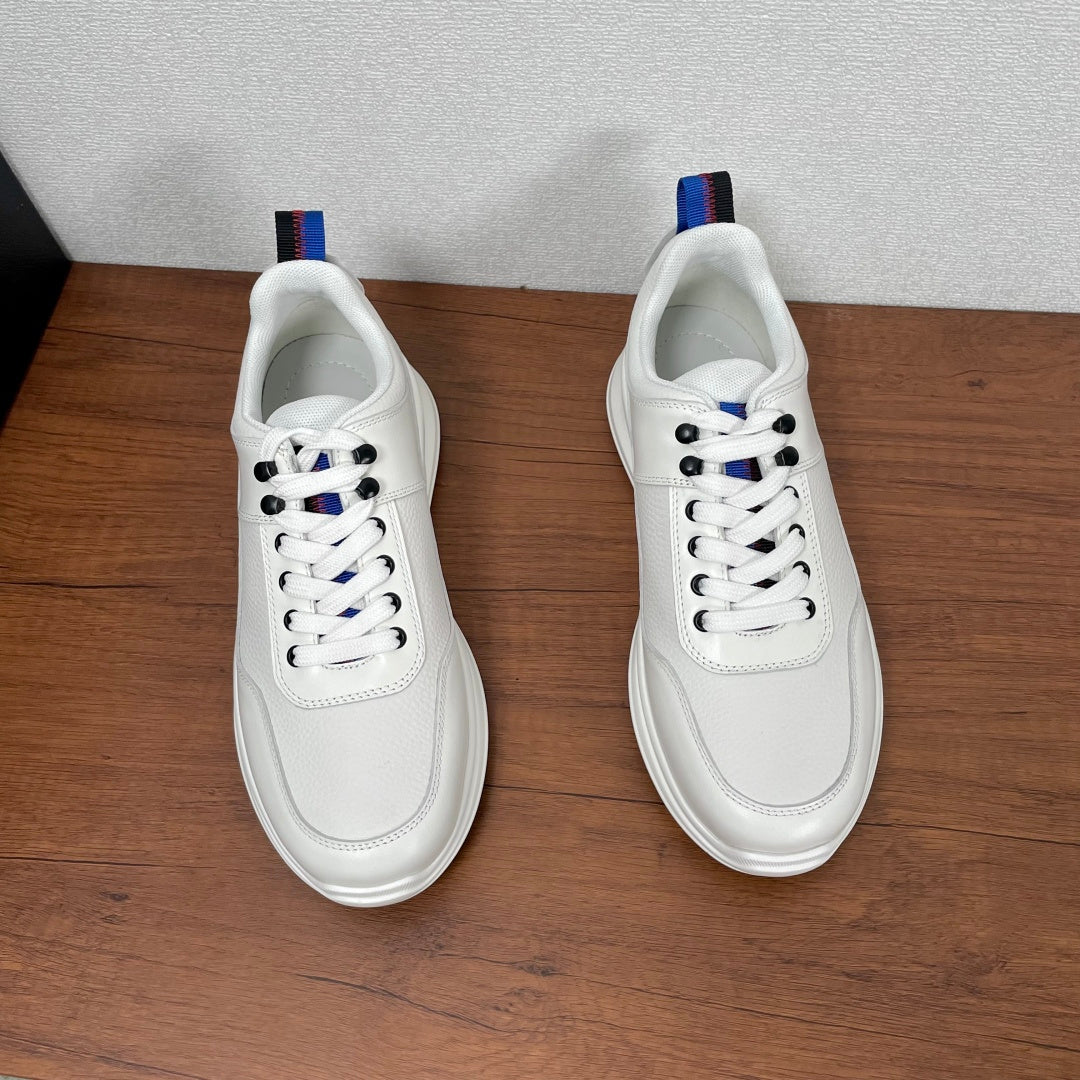 Prada unisex sneakers front view, white uppers with blue-red heel tabs
