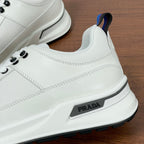 Prada unisex sneaker side close-up, white leather with PRADA logo patch