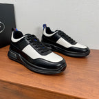 Prada unisex sneakers in black with white quarter panels and navy-red heel accents