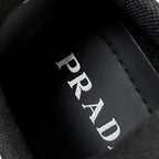 Prada logo on black inner lining near sock collar on unisex sneakers