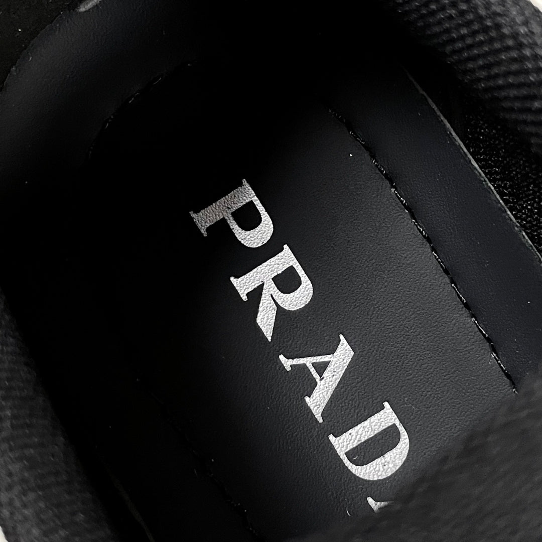 Prada logo on black inner lining near sock collar on unisex sneakers