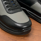 Prada unisex sneaker toe and lace-up front, black and gray leather with rubber trim