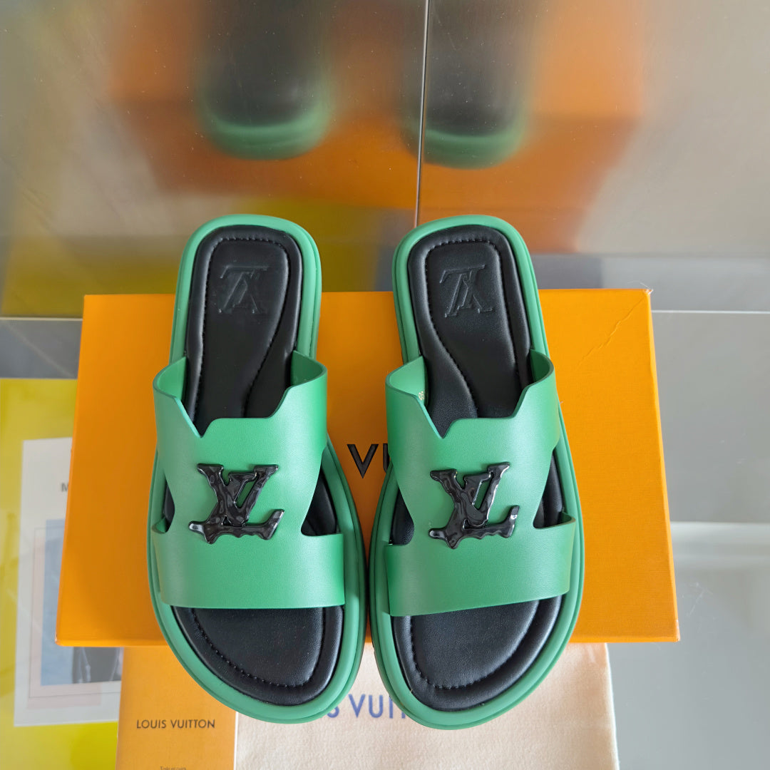 Louis Vuitton mint green slide sandals with black footbeds and front logo emblems