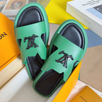 Louis Vuitton mint green sandals with black soles and front logo studs on straps
