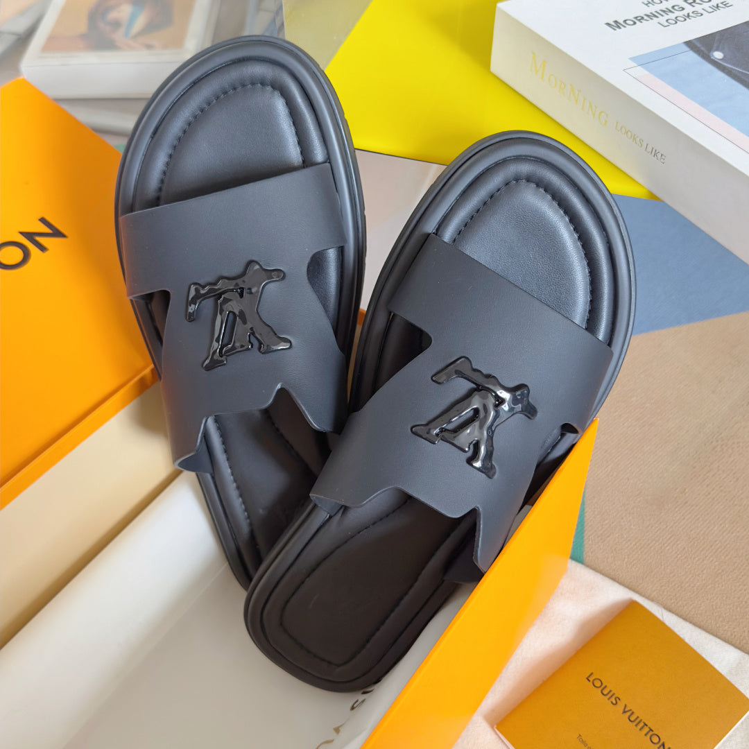 Dark gray leather slide sandals showing front strap and embossed Louis Vuitton logo