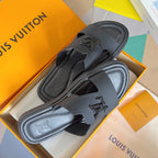Dark gray leather slide sandals with cutout strap and embossed Louis Vuitton logo