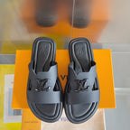 Dark gray leather slide sandals pair, front straps with embossed Louis Vuitton logos