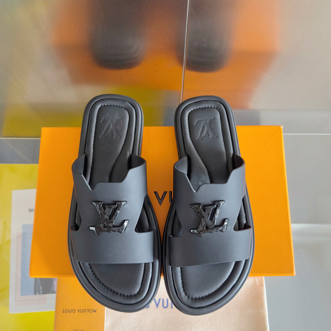 Dark gray leather slide sandals pair, front straps with embossed Louis Vuitton logos