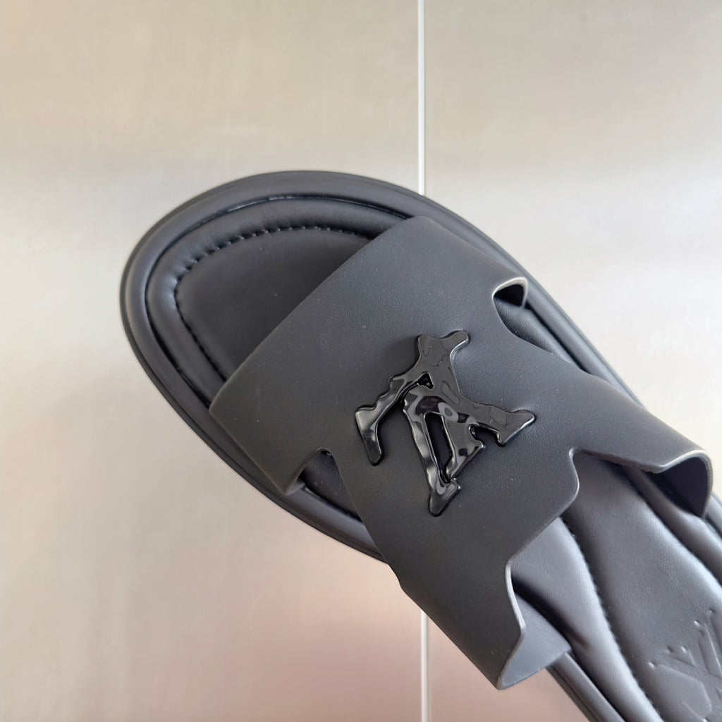 Dark gray leather slide sandal upper with cutout strap and embossed Louis Vuitton logo