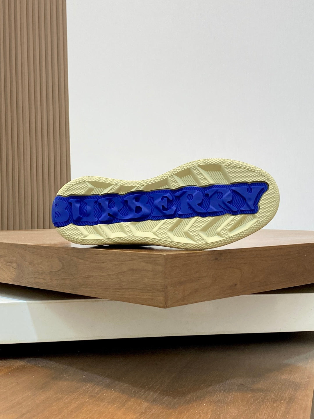 Burberry beige sneaker outsole with blue textured traction tread