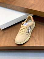 Burberry beige lace-up sneakers with tartan side panel, on display