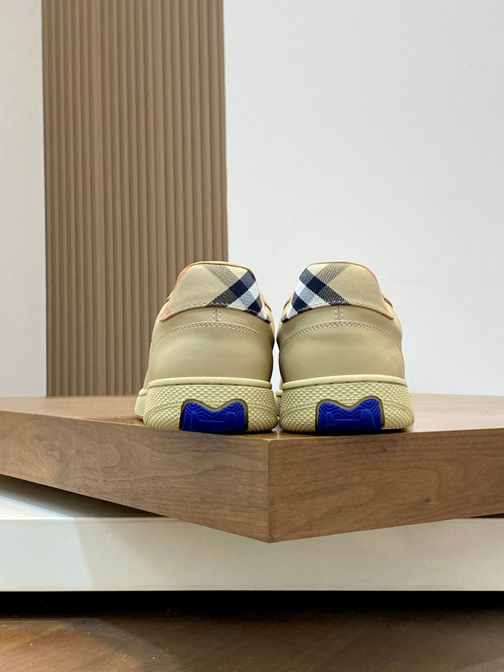 Burberry beige sneakers, back view with blue heel accents
