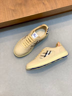 Burberry beige sneakers, side view with blue-and-white check accent