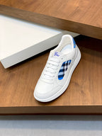 White sneaker with blue check panel and Burberry logo on the tongue