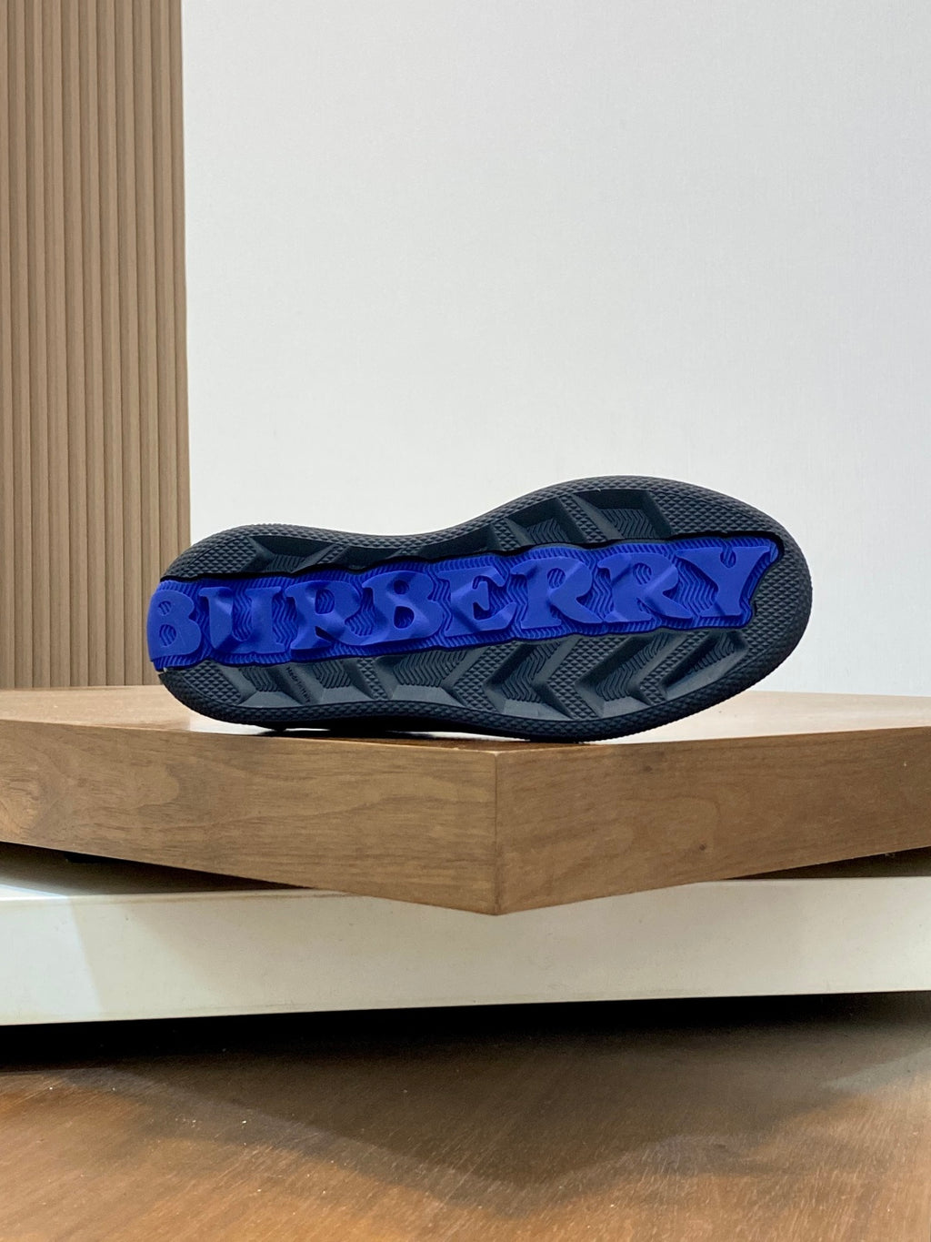 Burberry sneaker outsole, blue tread with Burberry lettering on the heel