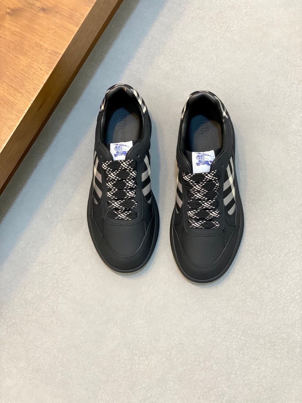 Burberry low-top sneakers, dark leather with check panel and blue sole