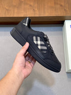 Burberry low-top sneaker, dark upper with check insert and lace-detailed front