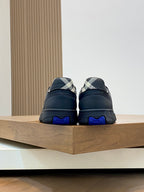 Burberry low-top sneakers, back view pair with blue heel tabs and check accents
